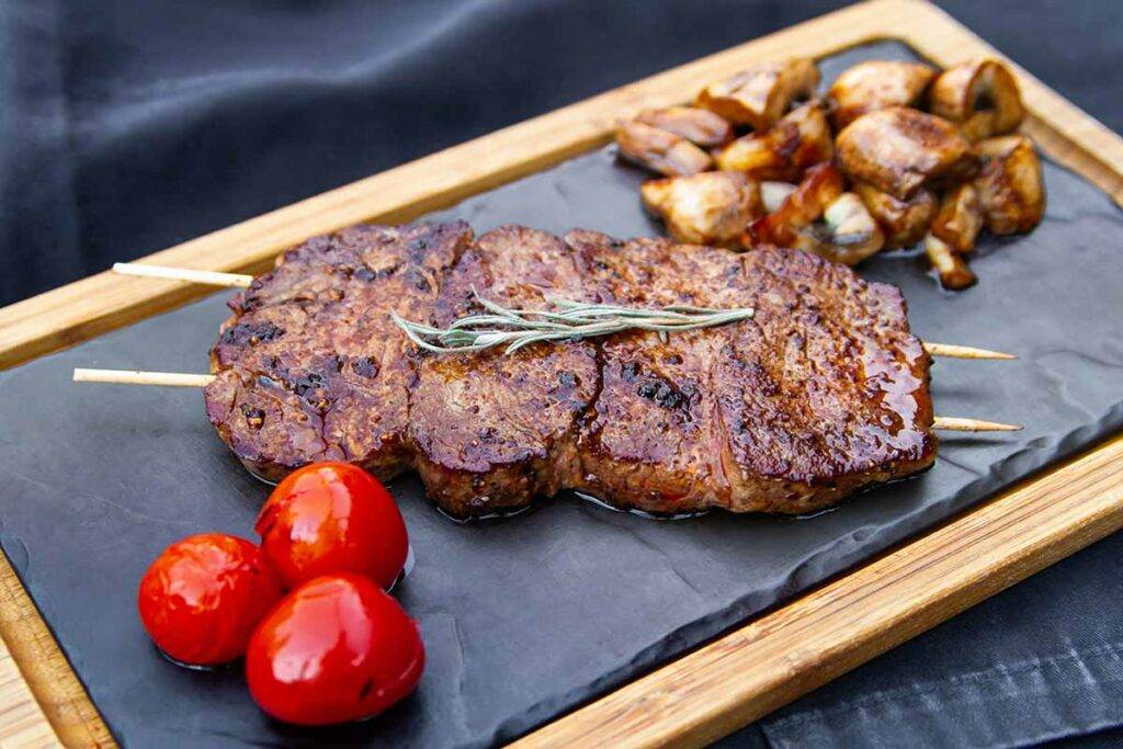 Beef hanger steak Tataki, fresh coriander, pine nuts and chicken butter