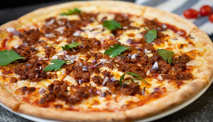 Toothsome Jack O’Lantern-themed chili pizza with a spicy flavor. 