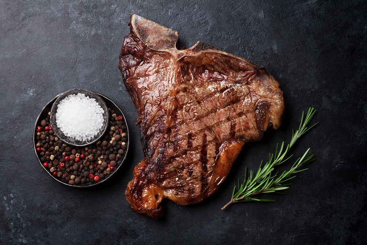 greek seasoned t bone steaks with cucumber and tomato salad