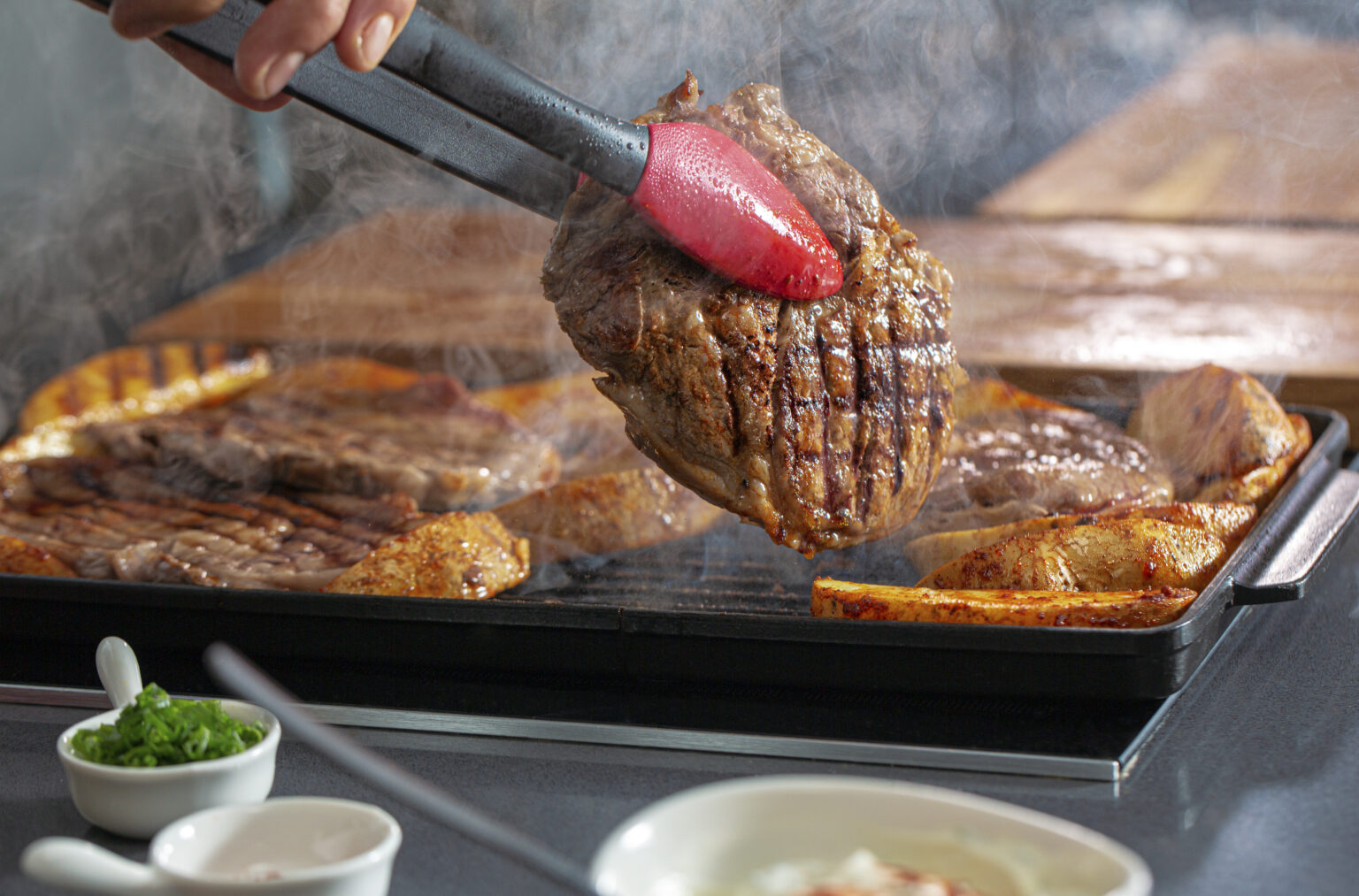 GRILLED RIBEYE STEAKS AND POTATOES WITH SMOKY PAPRIKA RUB