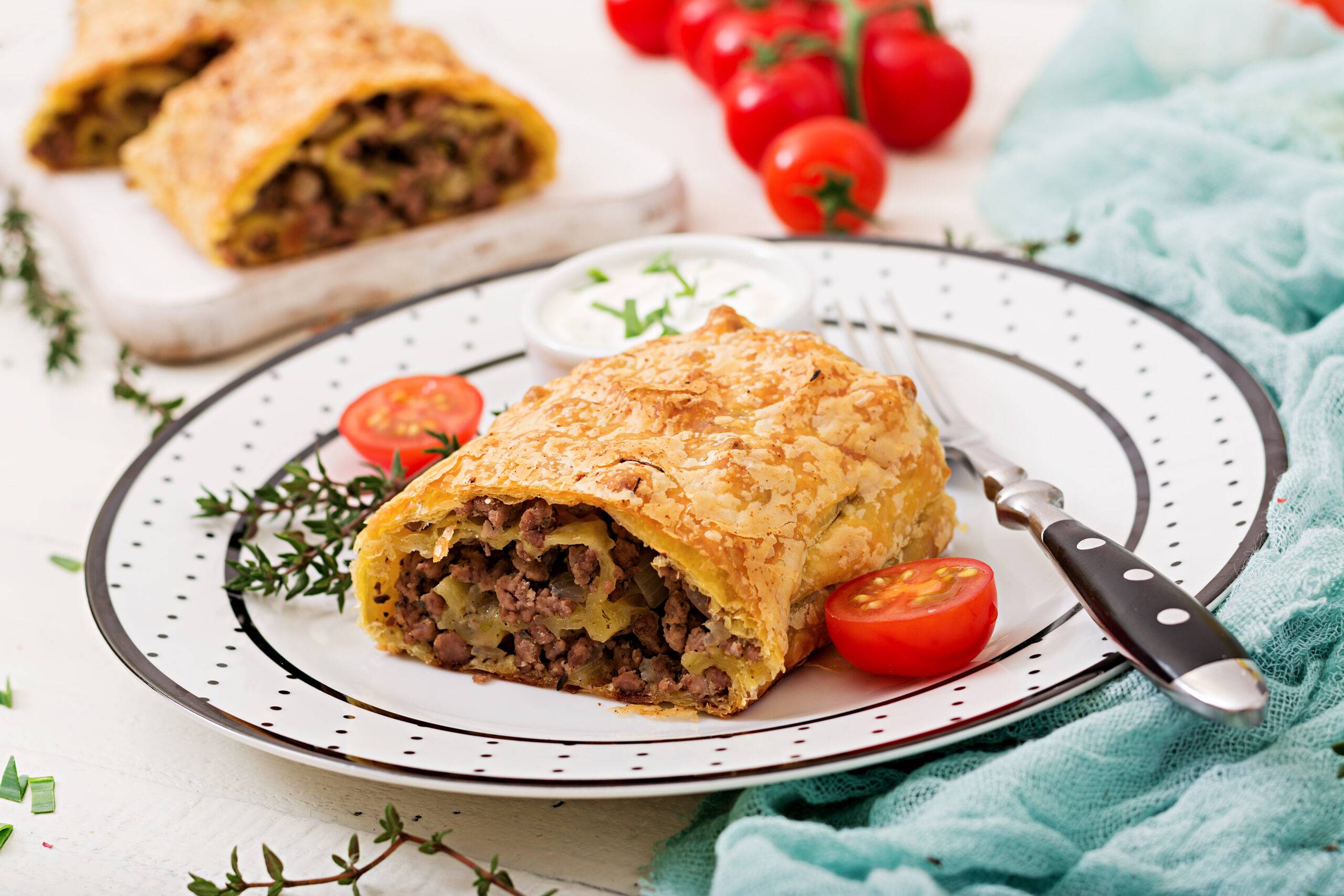 appetizing strudel with minced beef onions and herbs