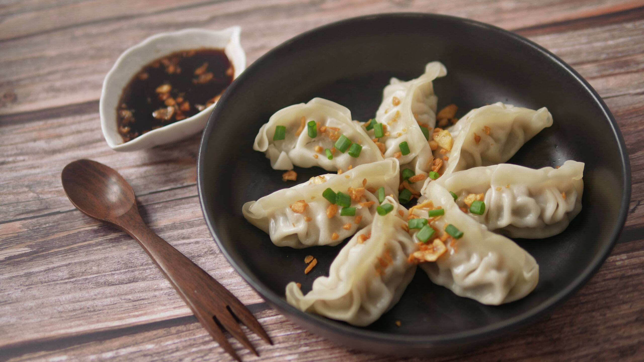 steamed gyoza or dumpling stuffed ground pork dipping with garlic