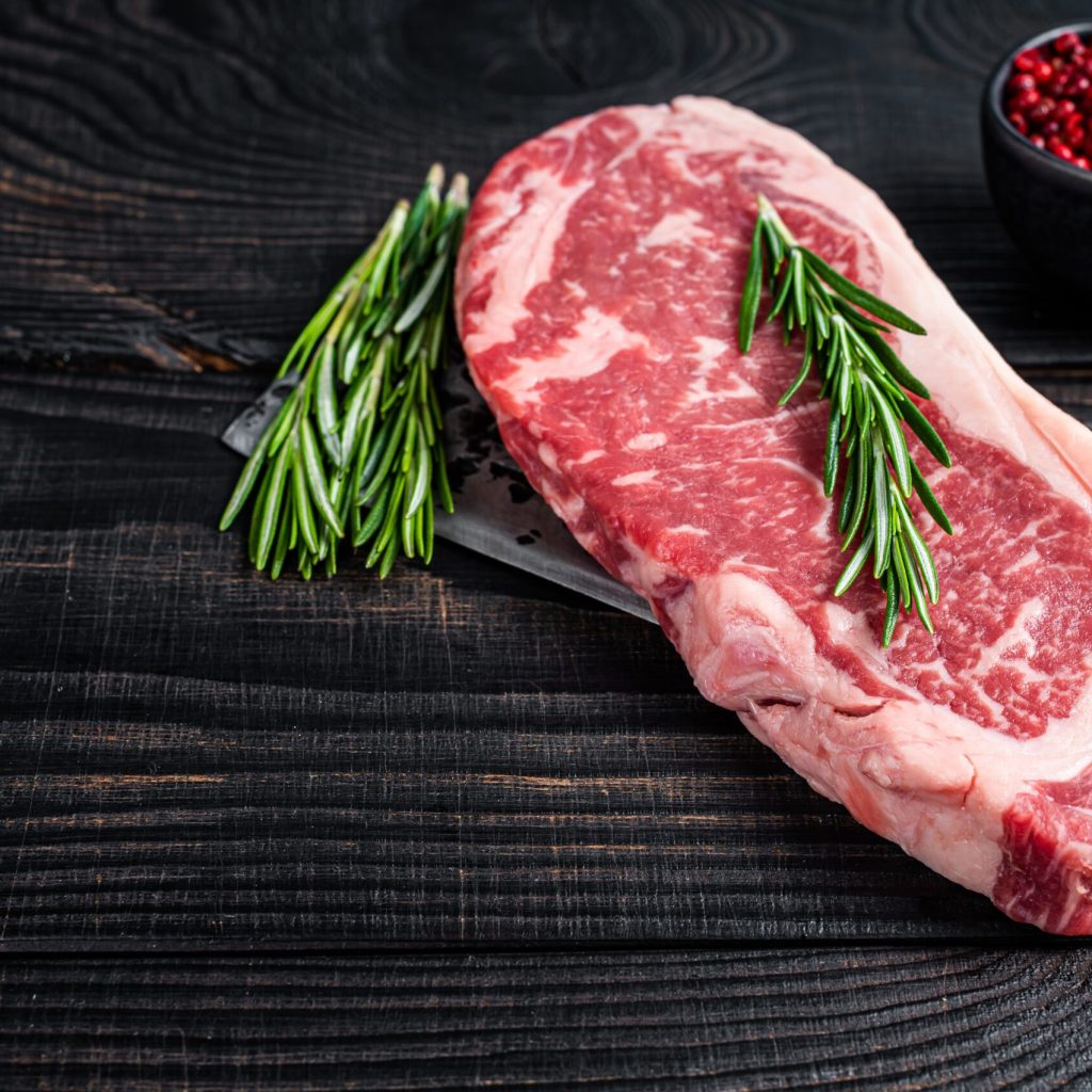 Fresh,Raw,New,York,Strip,Beef,Steak,On,A,Butcher Quality 'we bring US to you'